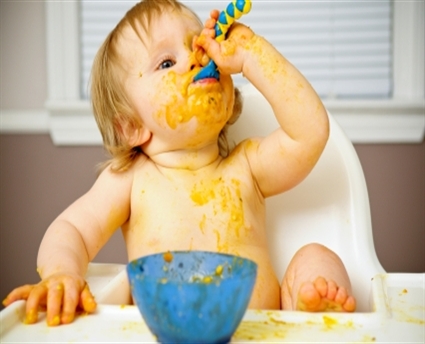 Messy-baby-eating-baby-food